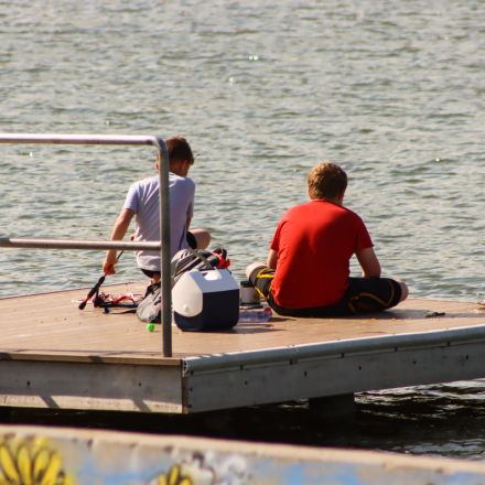 kids fishing on a dock